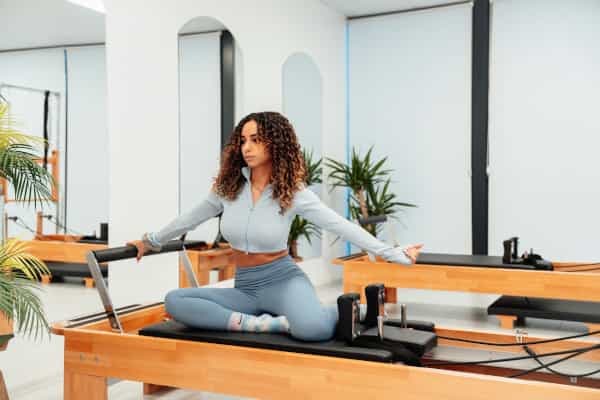 What is Reformer Pilates? Machine vs Mat Explained